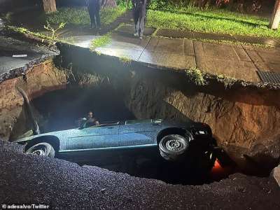 Un énorme gouffre à Irondequoit, New York, avale une voiture et sa conductrice après une inondation alors qu’une femme terrifiée est entendue « crier à l’aide »