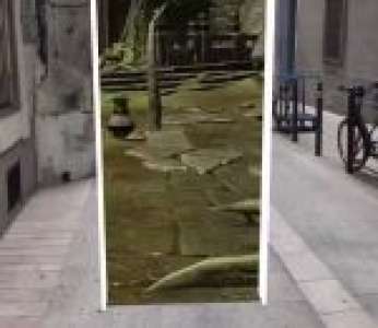 Il crée une porte interdimensionnelle dans la rue grâce à la réalité augmentée